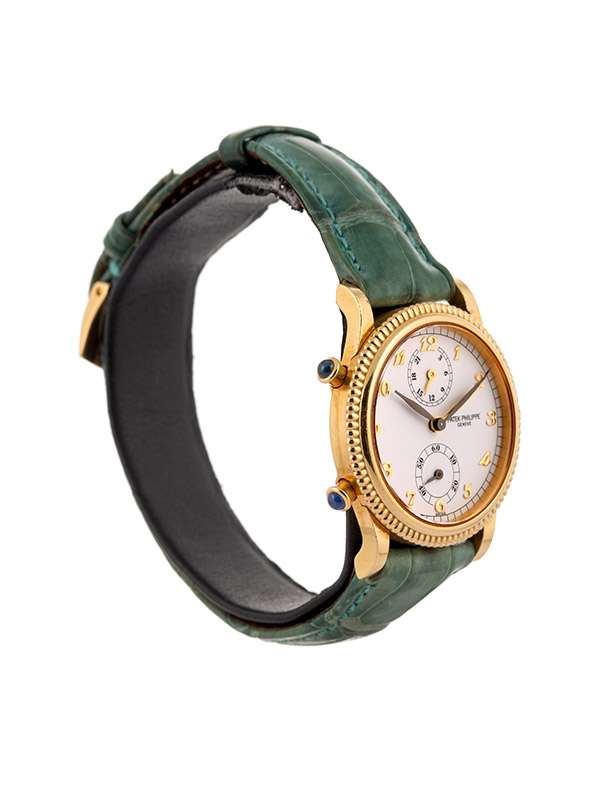 PATEK PHILIPPE TRAVEL TIME 30MM IN ORO GIALLO 18KT REF. 4864J